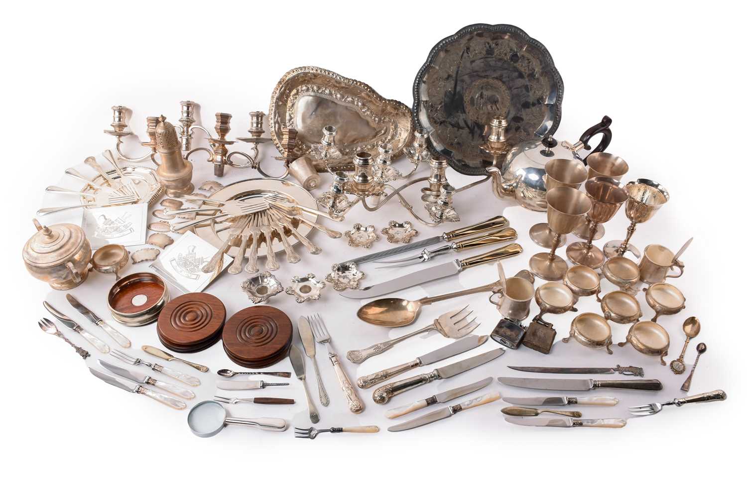 A large quantity of marked/unmarked white metal and silver-plated items including a five-sconce