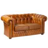A traditional leather Chesterfield two settee, 20th century, with deep buttoned cognac-coloured hide