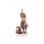 A Russian Gardner porcelain figure, 'The Ice Breaker', late 19th century, a fisherman wearing a