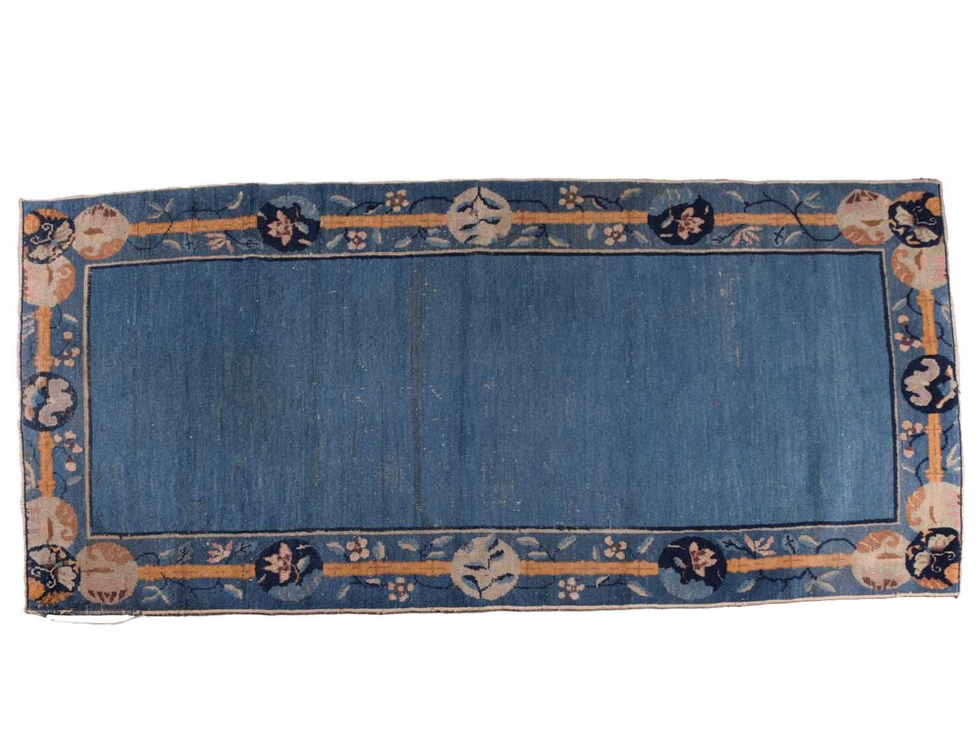 A Chinese Peking blue ground rug, late Qing, within borders of bamboo and butterflies, bearing a - Image 2 of 8