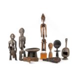 A collection of African ethnographica, comprising a Dogon seated female figure, 60.5cm (excluding