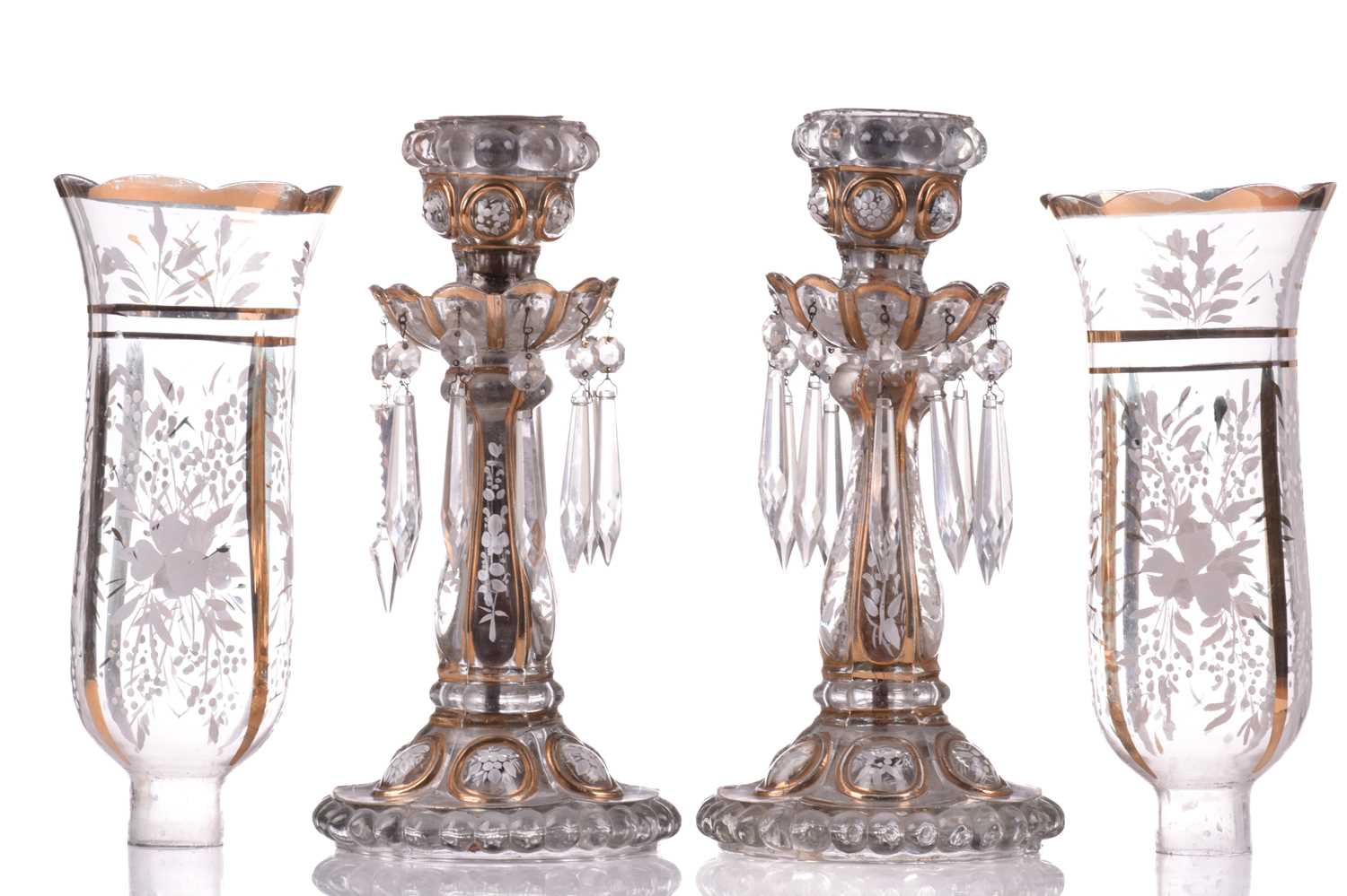 A pair of Victorian glass storm lights, with white enamel floral decoration and gilt highlights, the