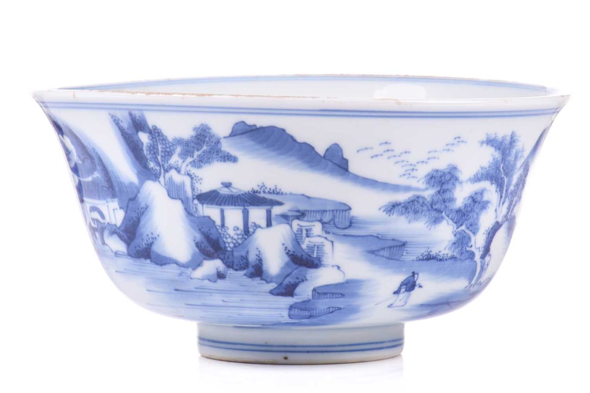 A Chinese blue and white Kangxi style porcelain bowl, with a slightly everted rim painted with