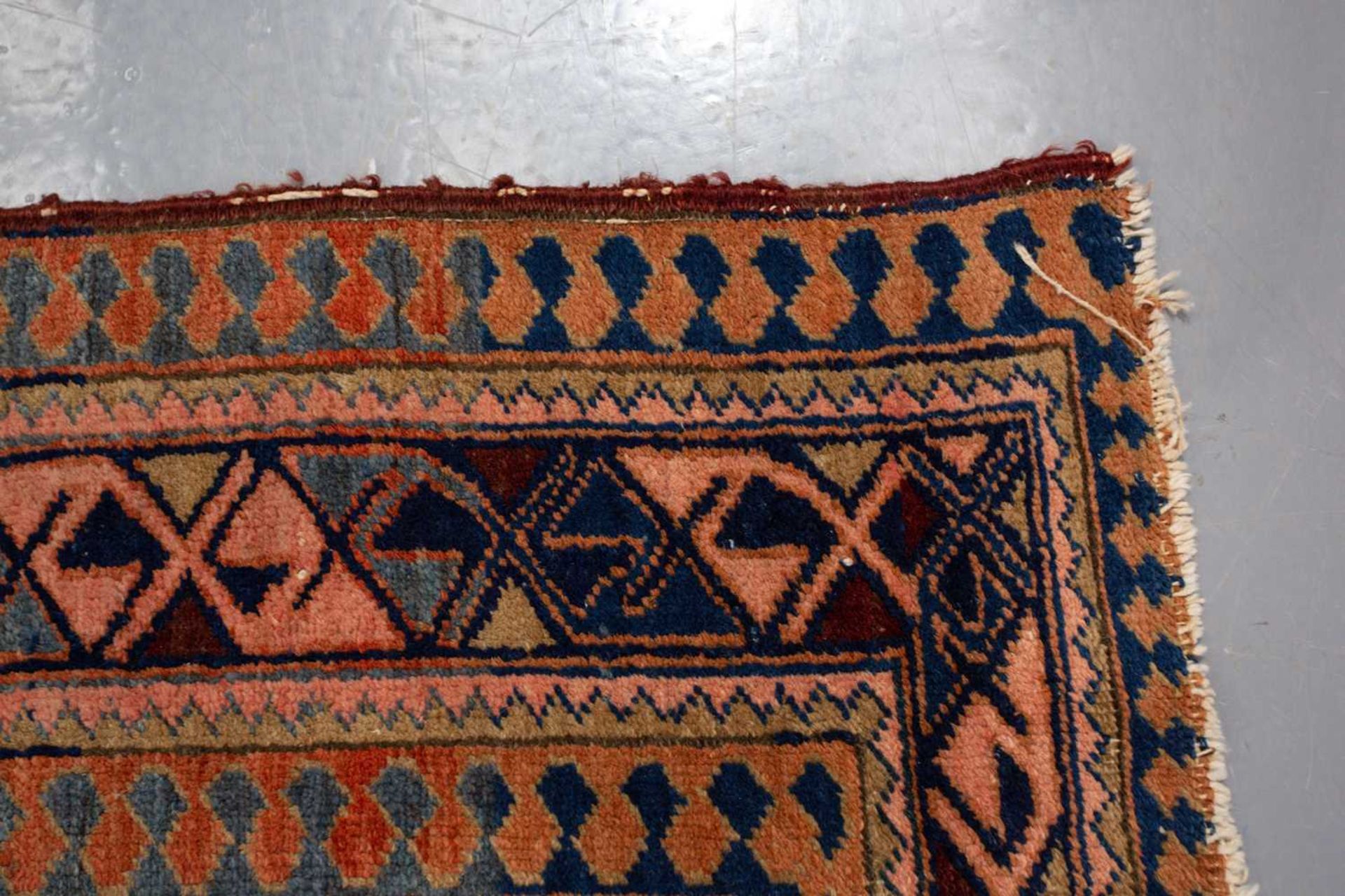 A Caucasian rug with overall star decoration on a muted red ground, probably early 20th-century - Image 6 of 8