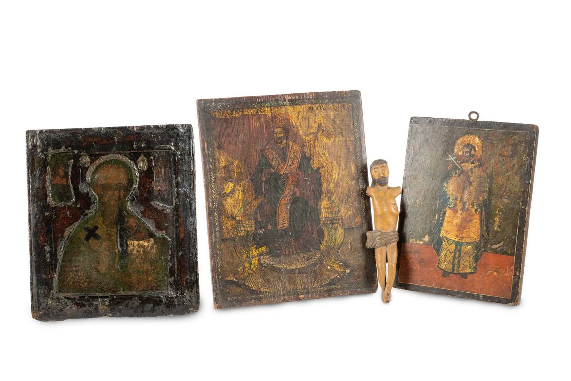 A large 19th /20th-century Russian icon painted with a single Saint in blue robes with a radiant