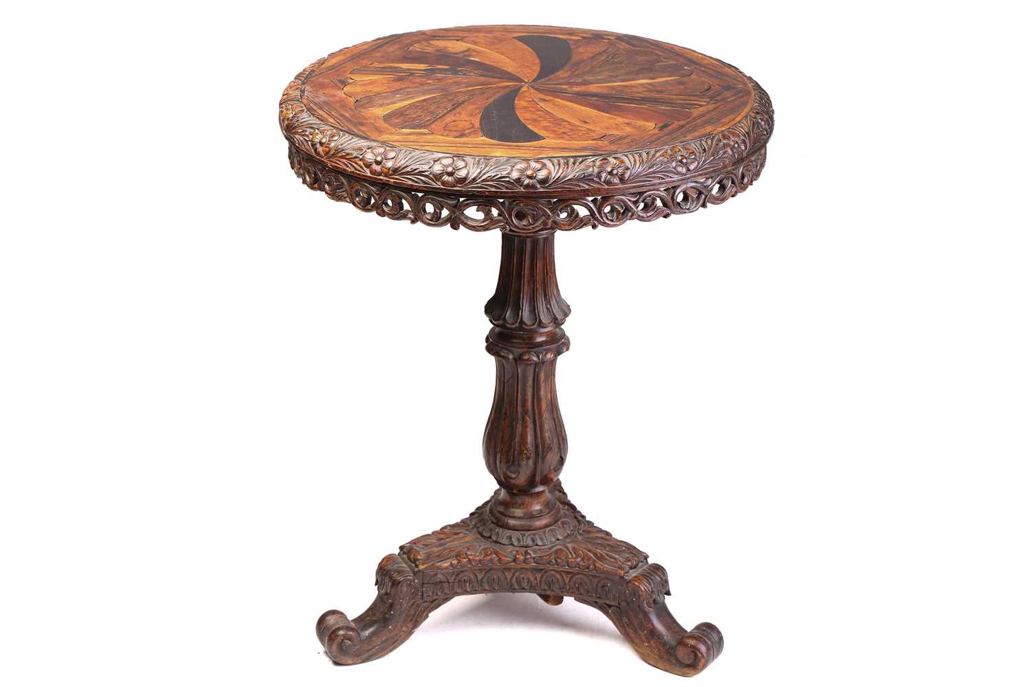 An Anglo Ceylonese circular rosewood and specimen timber centre table, the second quarter of the