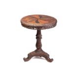 An Anglo Ceylonese circular rosewood and specimen timber centre table, the second quarter of the