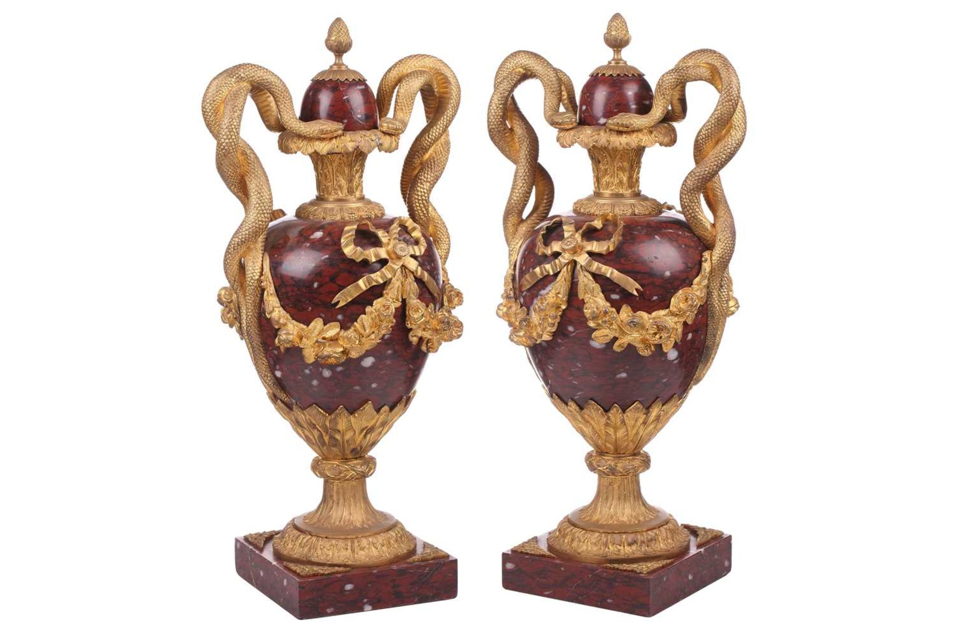 A pair of fine large Napoleon III rouge marble and ormolu serpent-handled urns and covers, each body