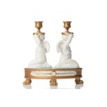 A 19th-century Jacquet et Nedonchelle (Bruxelles) porcelain double candlestick, formed with kneeling