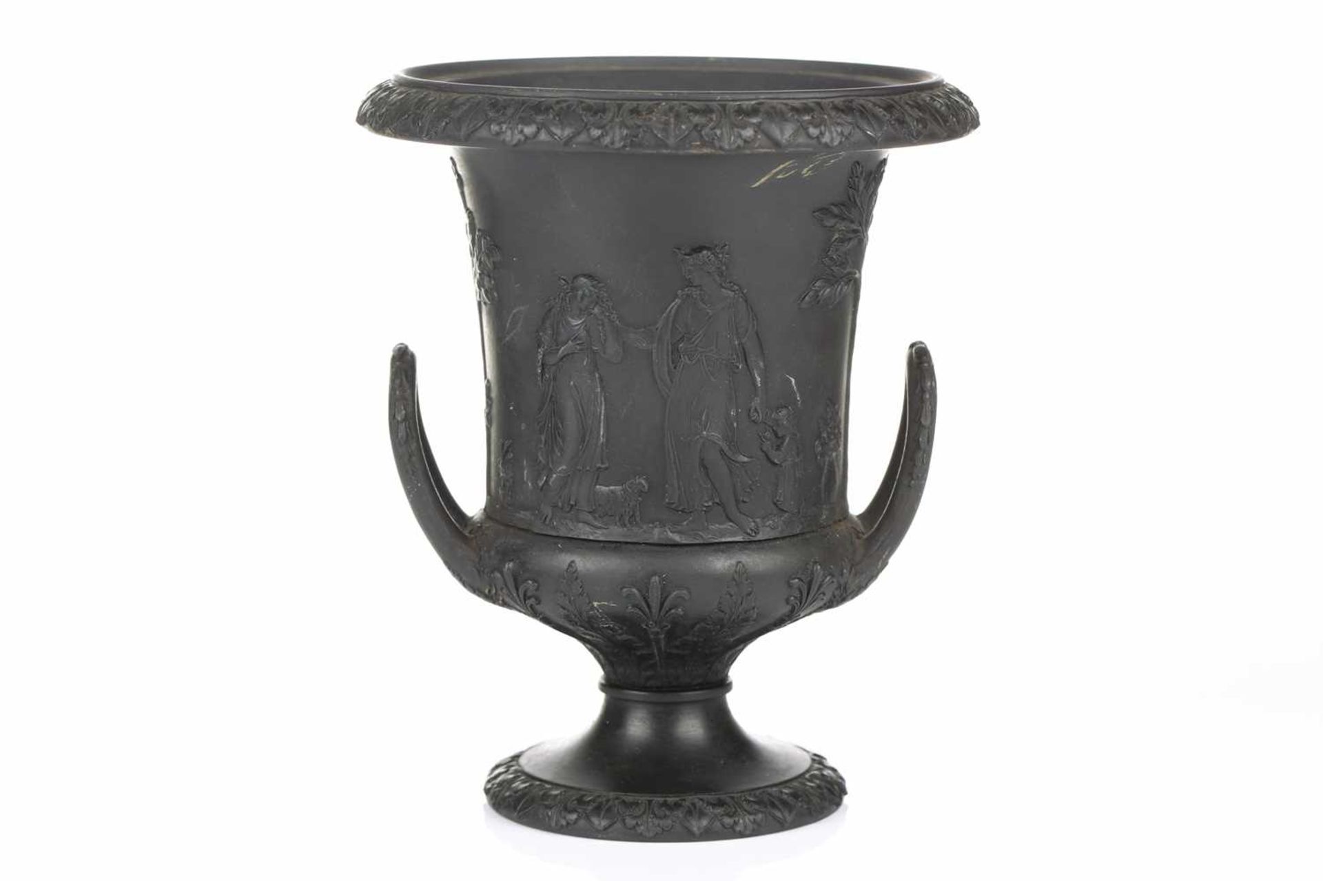 A 19th century Wedgwood black basalt urn of Campagna form, relief decorated with neo-classical