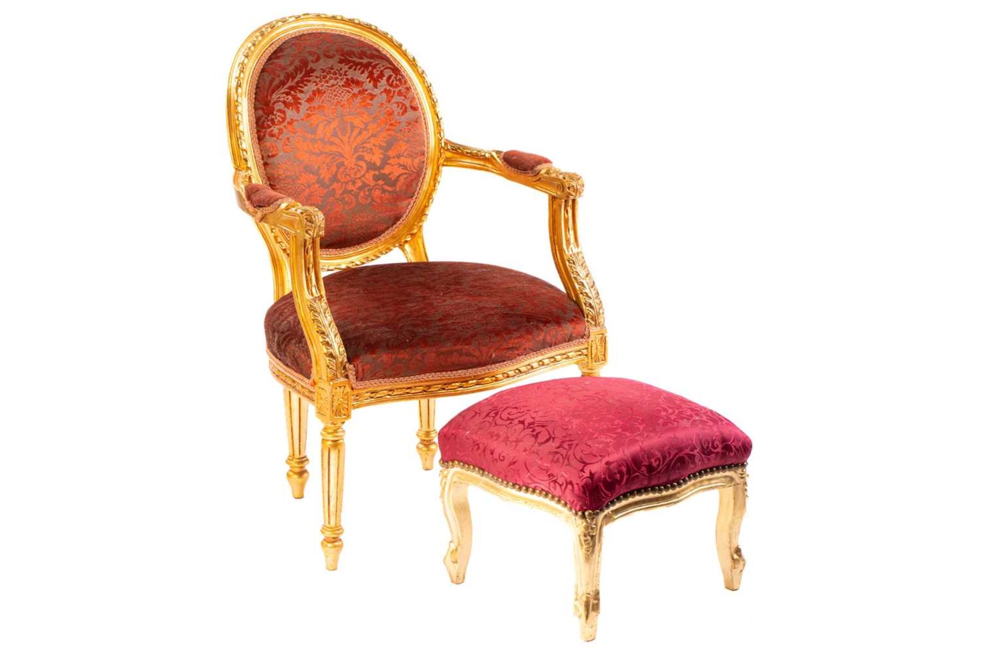 A Louis XVI style gilt wood fauteuil, 20th century, with cameo back and ribbon carved outline,