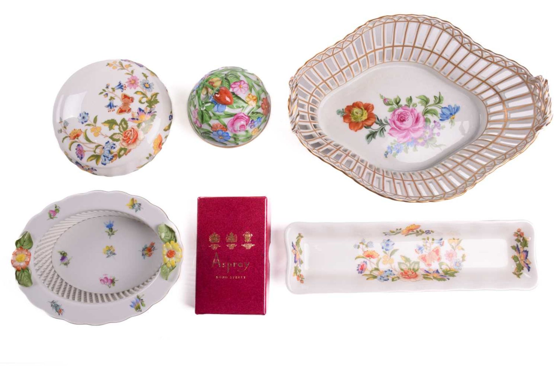 A collection of decorative ceramics items, including a two-handled Dresden chestnut basket,