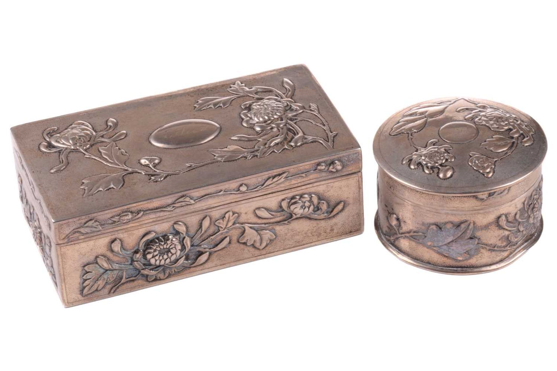 Two Chinese silver dressing table boxes, Hung Chong & Co, circa 1900, of rectangular and circular