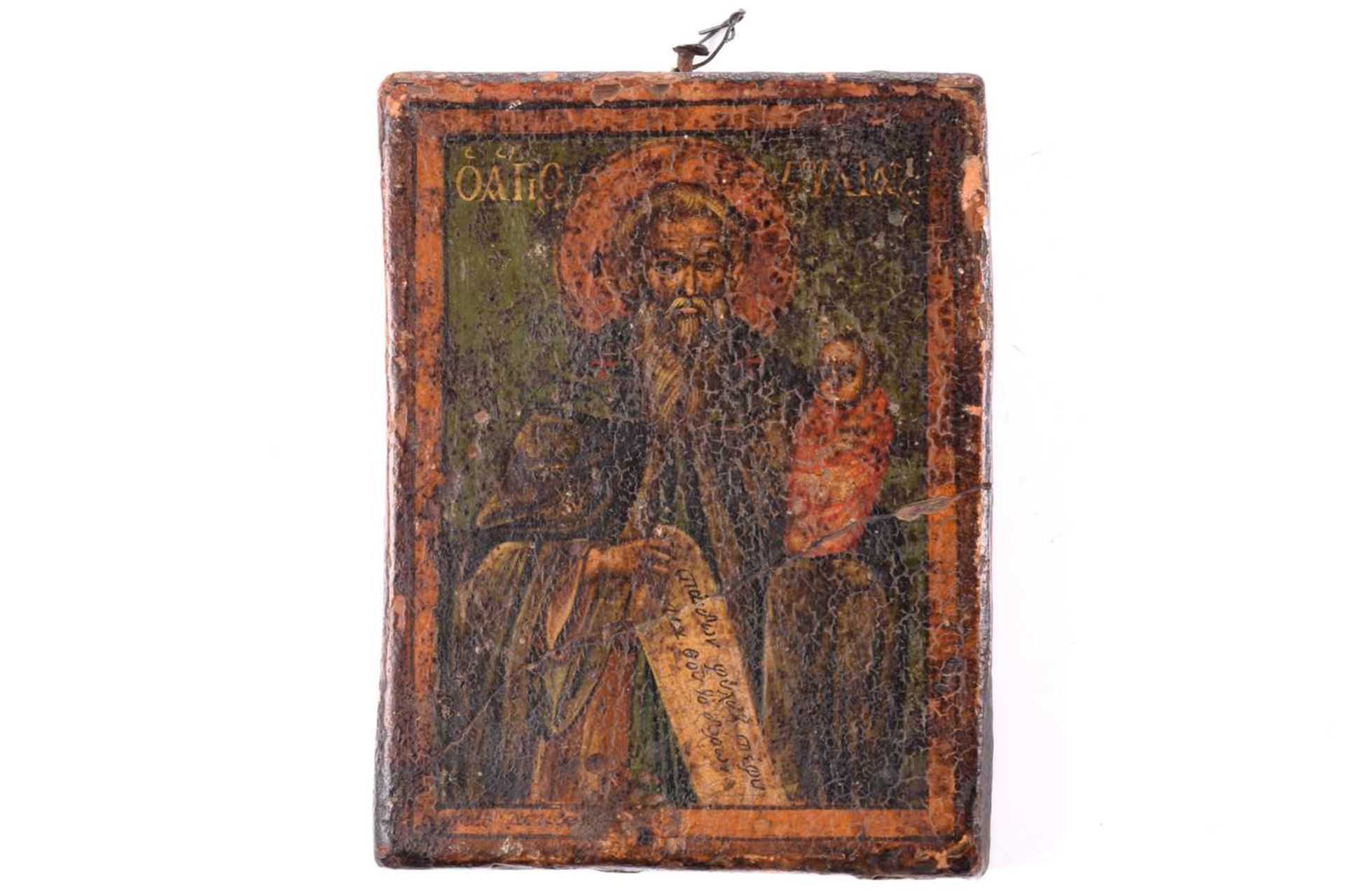 A Greek Orthodox icon of St. John of Patmos and infant Jesus, probably 18th century, with