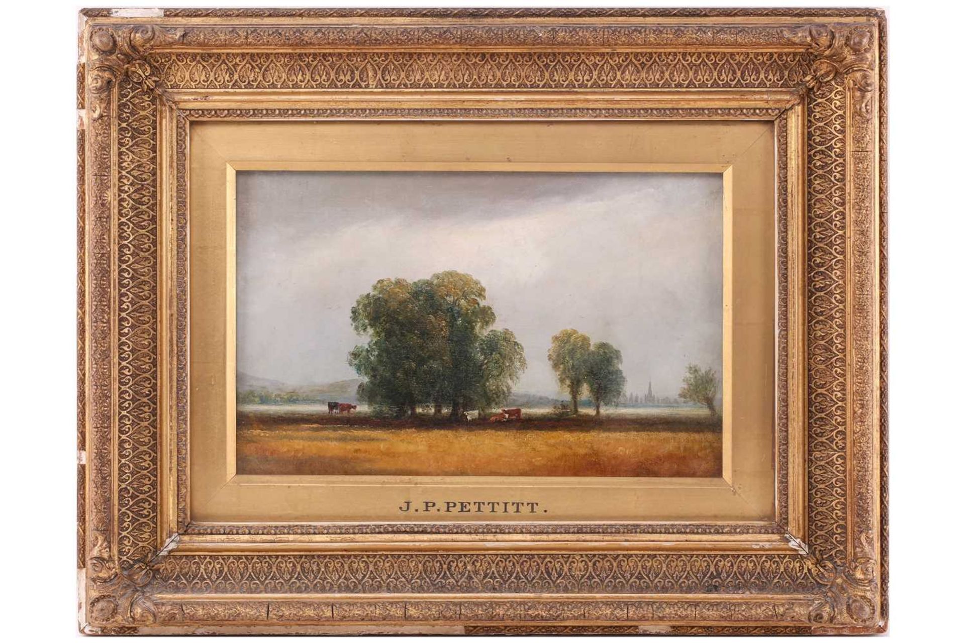 Manner of Joseph Paul Pettitt (1812 - 1882), cattle grazing beneath a tree, a town in the distant,