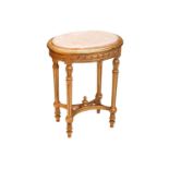 A Louis XVI style marble-topped oval giltwood table, 20th century with turned supports and shaped