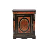 A Napoleon III style ebonized and red Boule worked pier cabinet the single door with a decorative