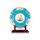 A Louis XVI Sevres soft paste porcelain bleu celeste dessert plate painted with faux osier borders