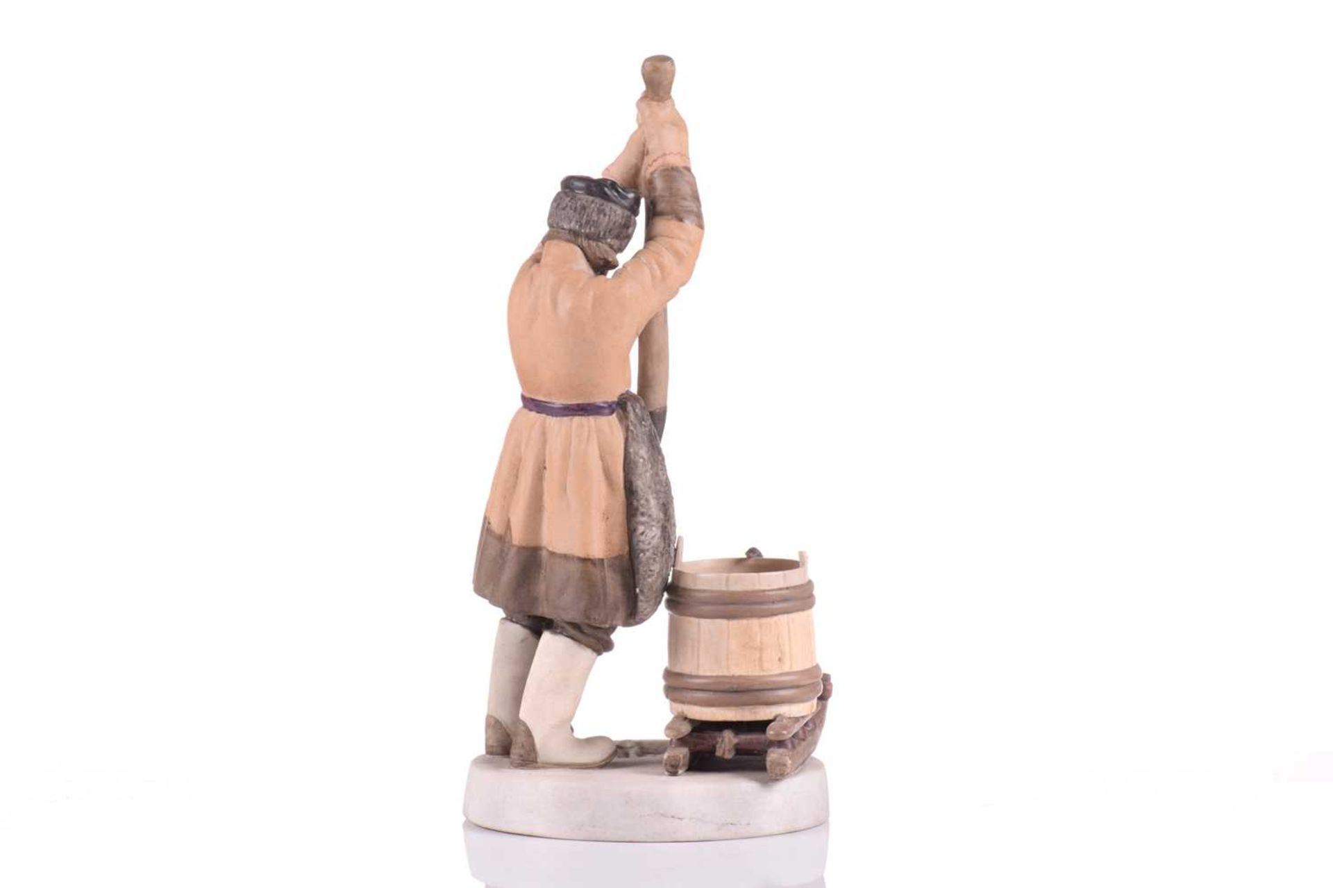 A Russian Gardner porcelain figure, 'The Ice Breaker', late 19th century, a fisherman wearing a - Image 2 of 6