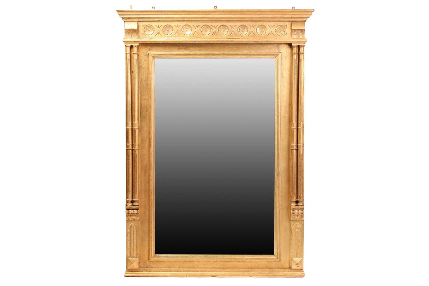 A Georgian style giltwood mirror, 20th century, the rectangular glass beneath a cavetto pediment and