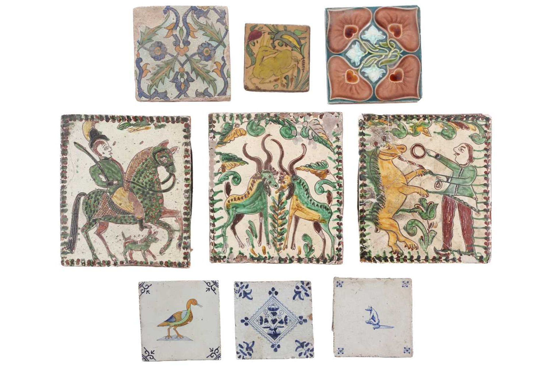 A collection of pottery tiles, comprising three Hutsul pottery stove tiles, depicting a dancing