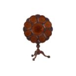A George III style mahogany revolving supper table, 20th century (but a faithful copy), the circular