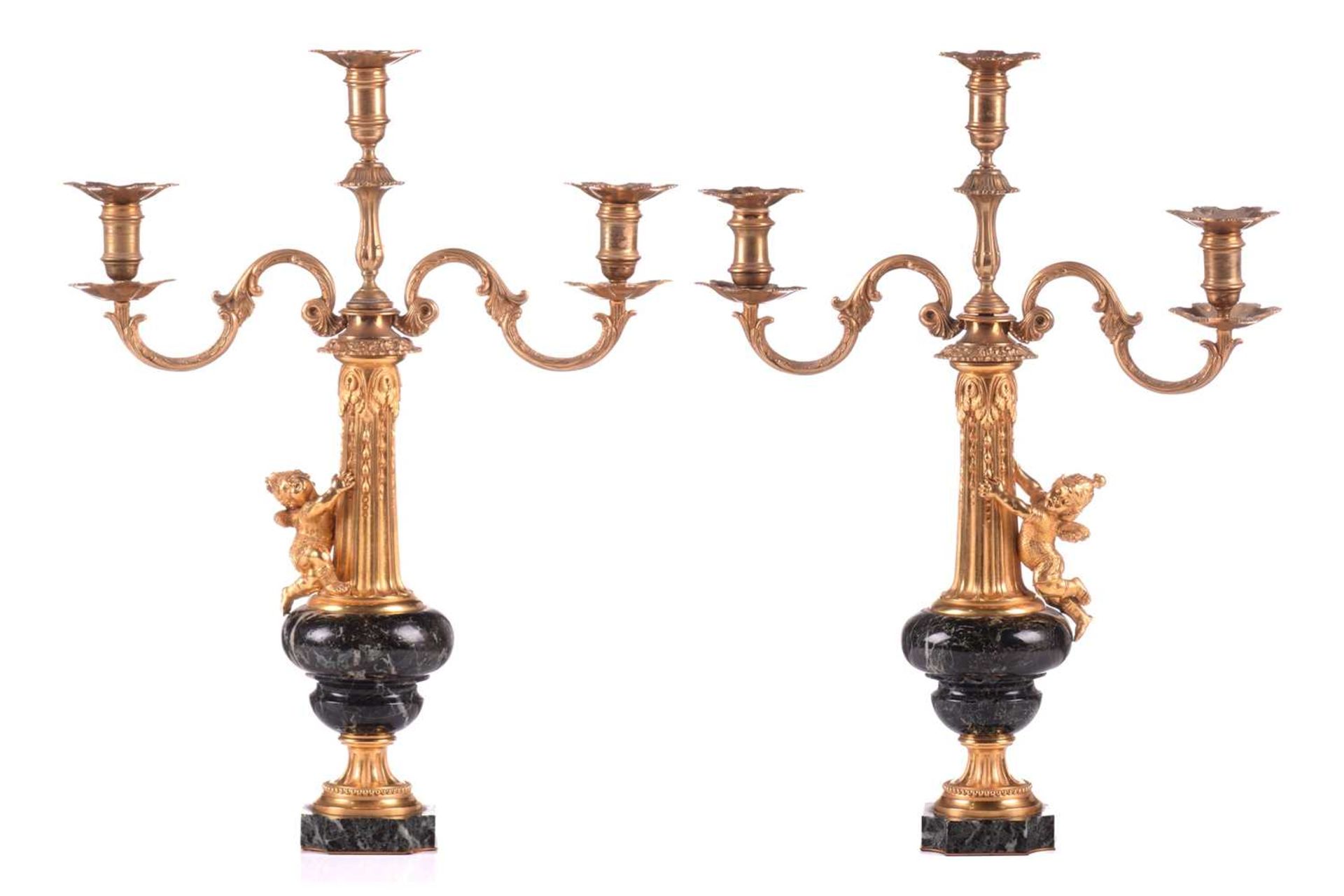 A pair of French marble and ormolu mounted candelabra, circa 1880, with two scrolling branches on