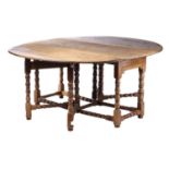 A late 17th-century style oval oak double gateleg table, 20th century with bobbin and blade turned