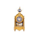 A Louis XVI-style gilt metal cased 8-day mantle clock of architectural arched form, with Sevres