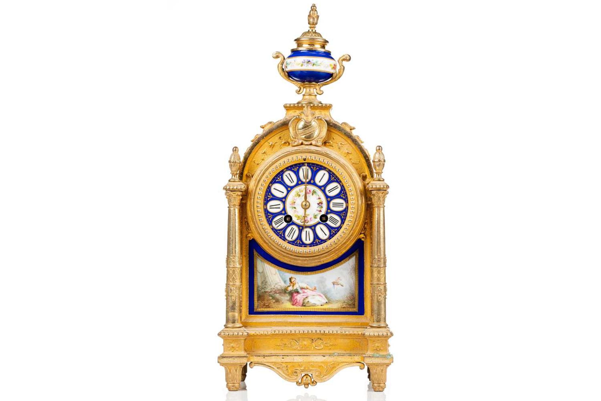 A Louis XVI-style gilt metal cased 8-day mantle clock of architectural arched form, with Sevres