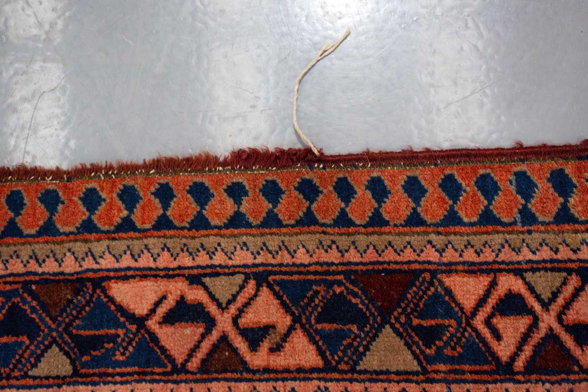 A Caucasian rug with overall star decoration on a muted red ground, probably early 20th-century - Image 7 of 8