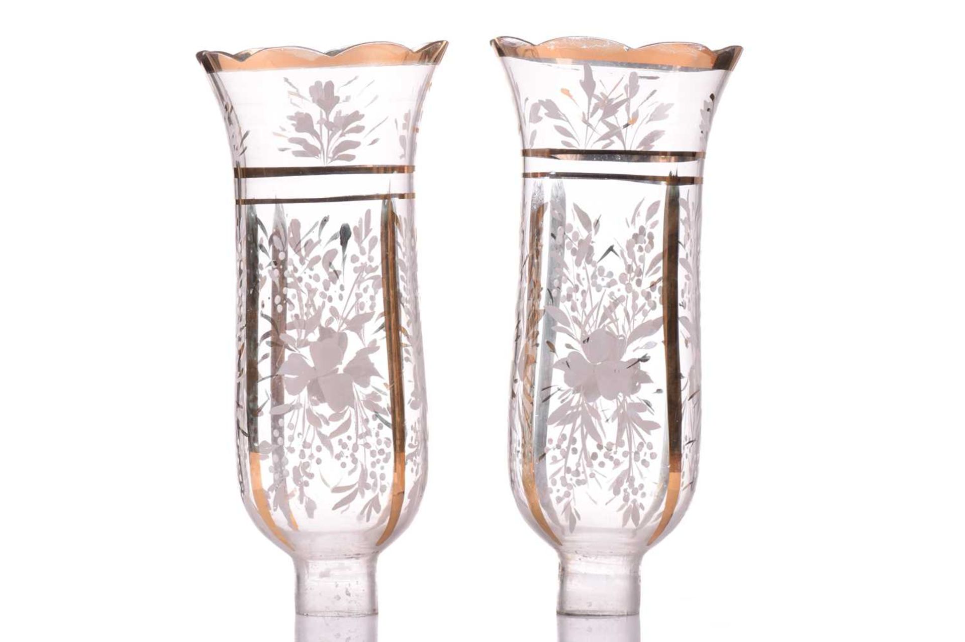 A pair of Victorian glass storm lights, with white enamel floral decoration and gilt highlights, the - Image 3 of 16