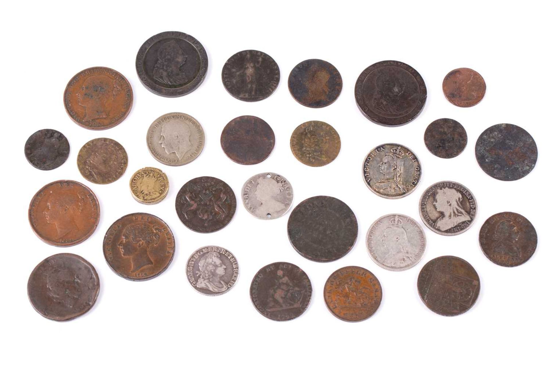 A collection of UK coins and trade tokens, comprising a Charles I 20 shilling coin weight, a William