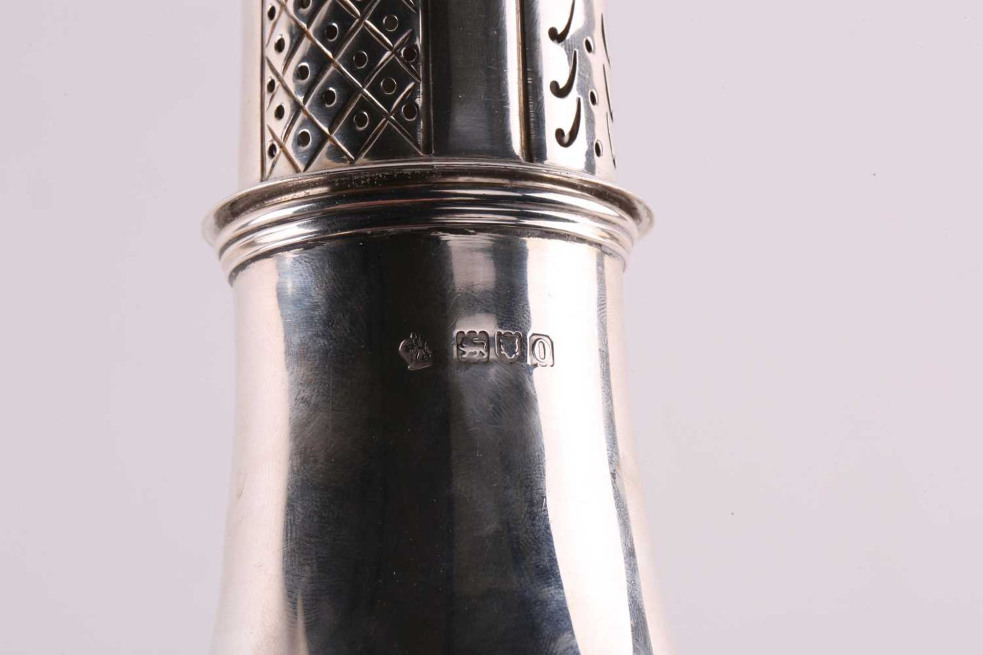 A silver sugar caster of baluster form the pull-off cover with pierced decoration and flame finial - Image 3 of 6