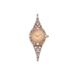 An early 20th century Russian ladies gold and diamond set wristwatch, the silvered dial with