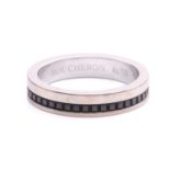 Boucheron - a 'Quatre' black edition wedding band, the polished flat band accented with studded