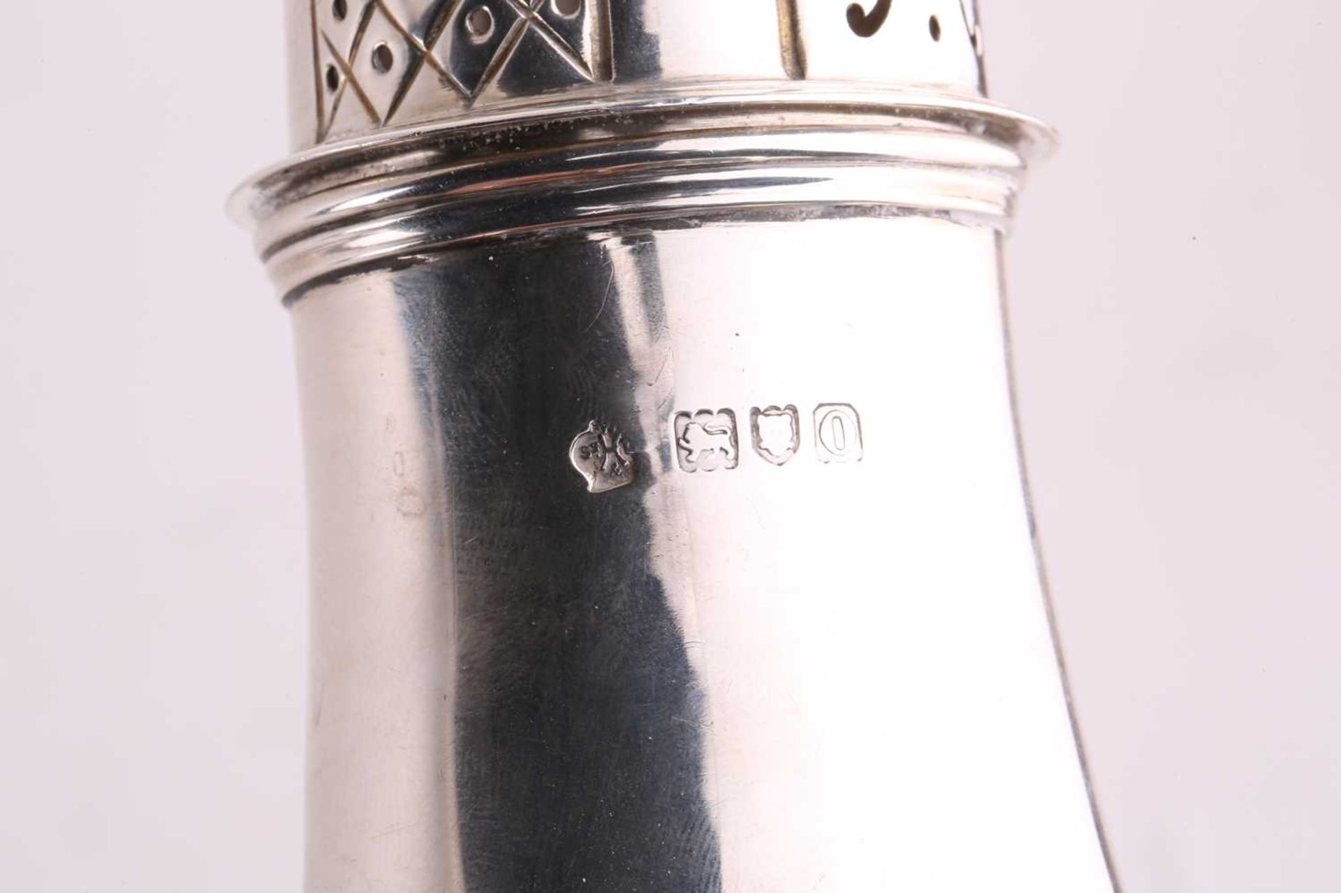 A silver sugar caster of baluster form the pull-off cover with pierced decoration and flame finial - Image 2 of 6