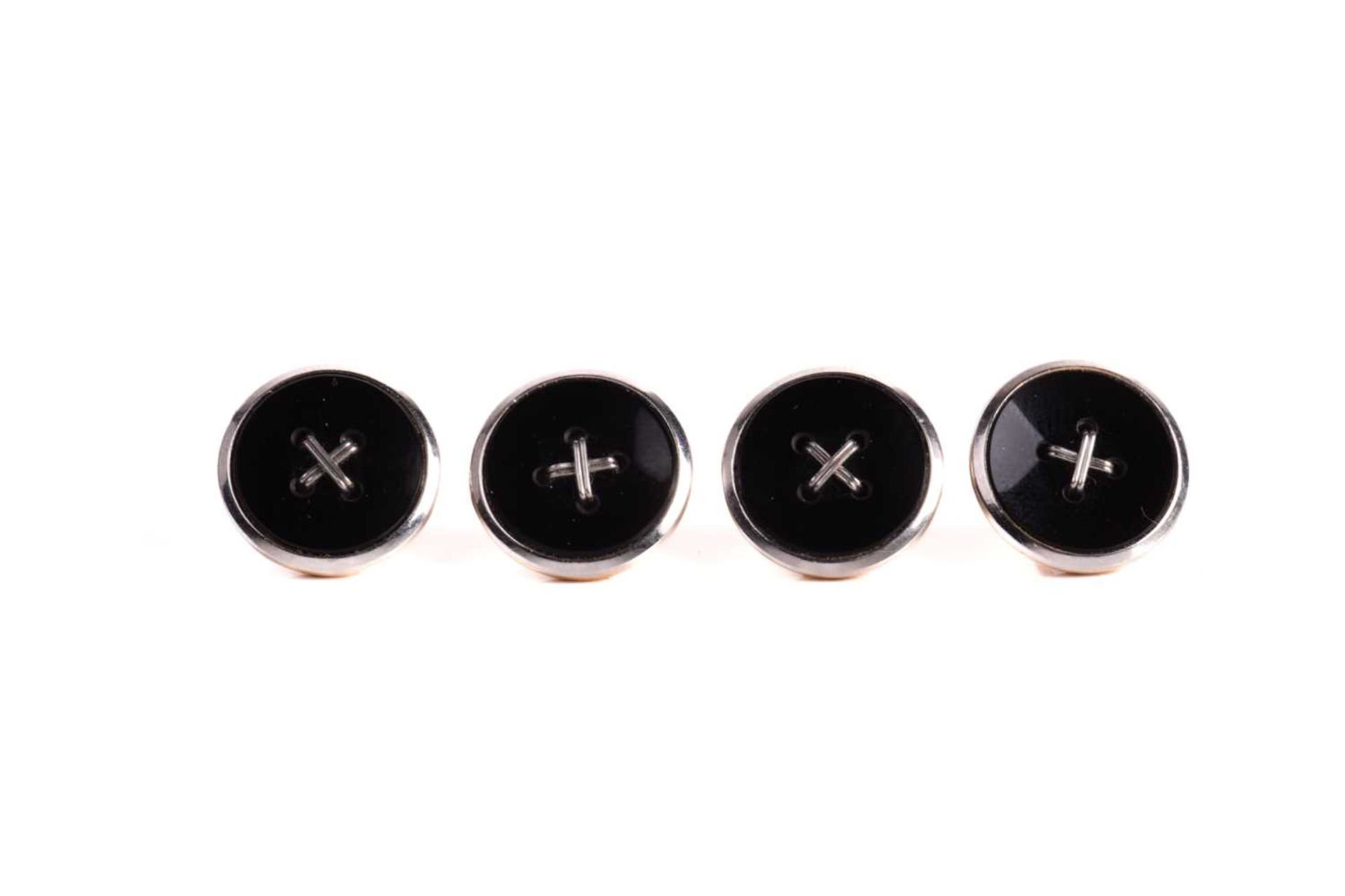 A set of four onyx and white metal dress buttons, of oval form with a roped-cross to the centre - Image 3 of 7