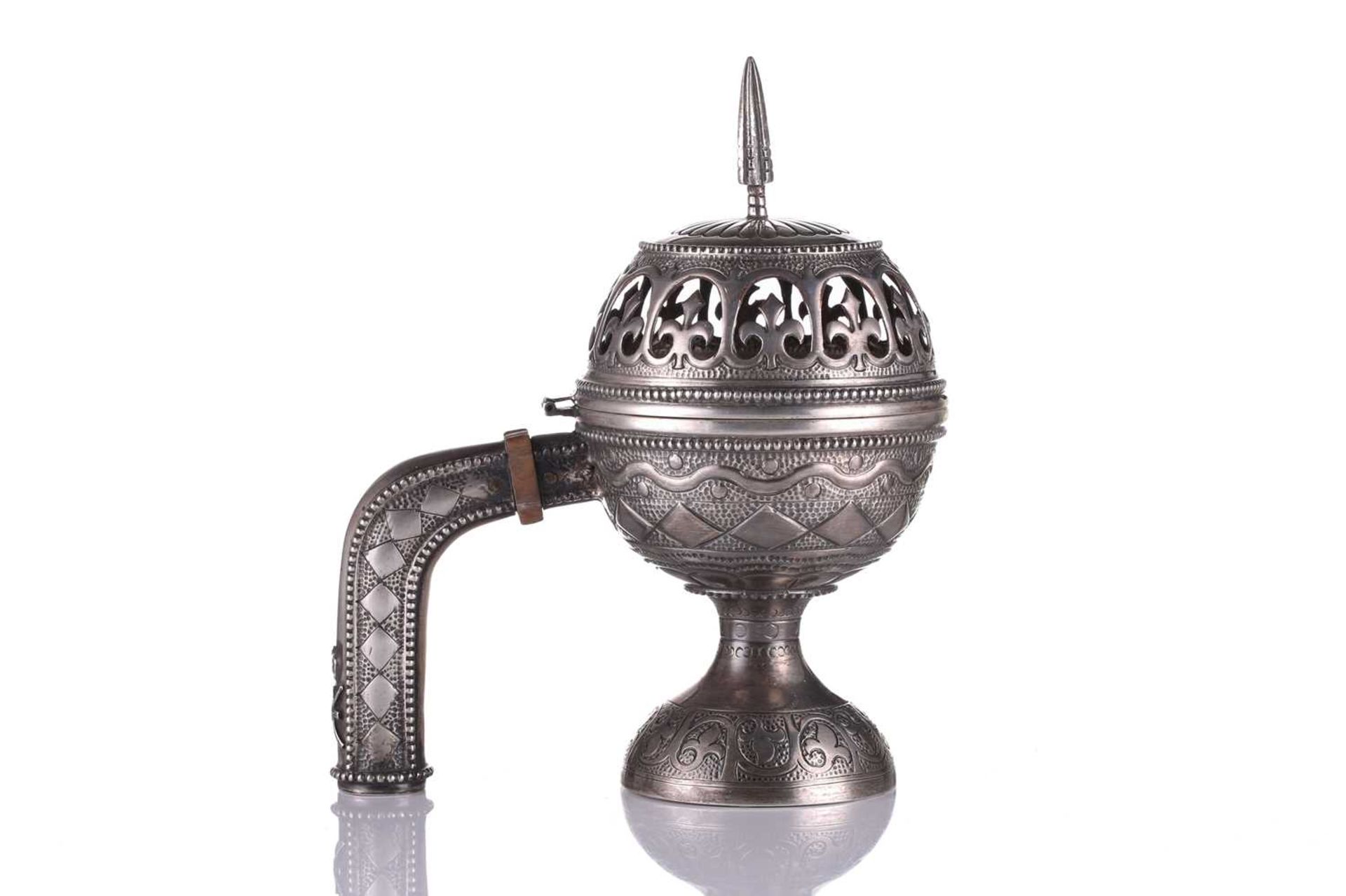 An Omani silver incense burner (Majmar), early 20th century, of typical pierced orb form with a