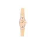 A ladies Movado 14ct yellow gold mechanical wristwatch, the plain gilt dial surrounded by a