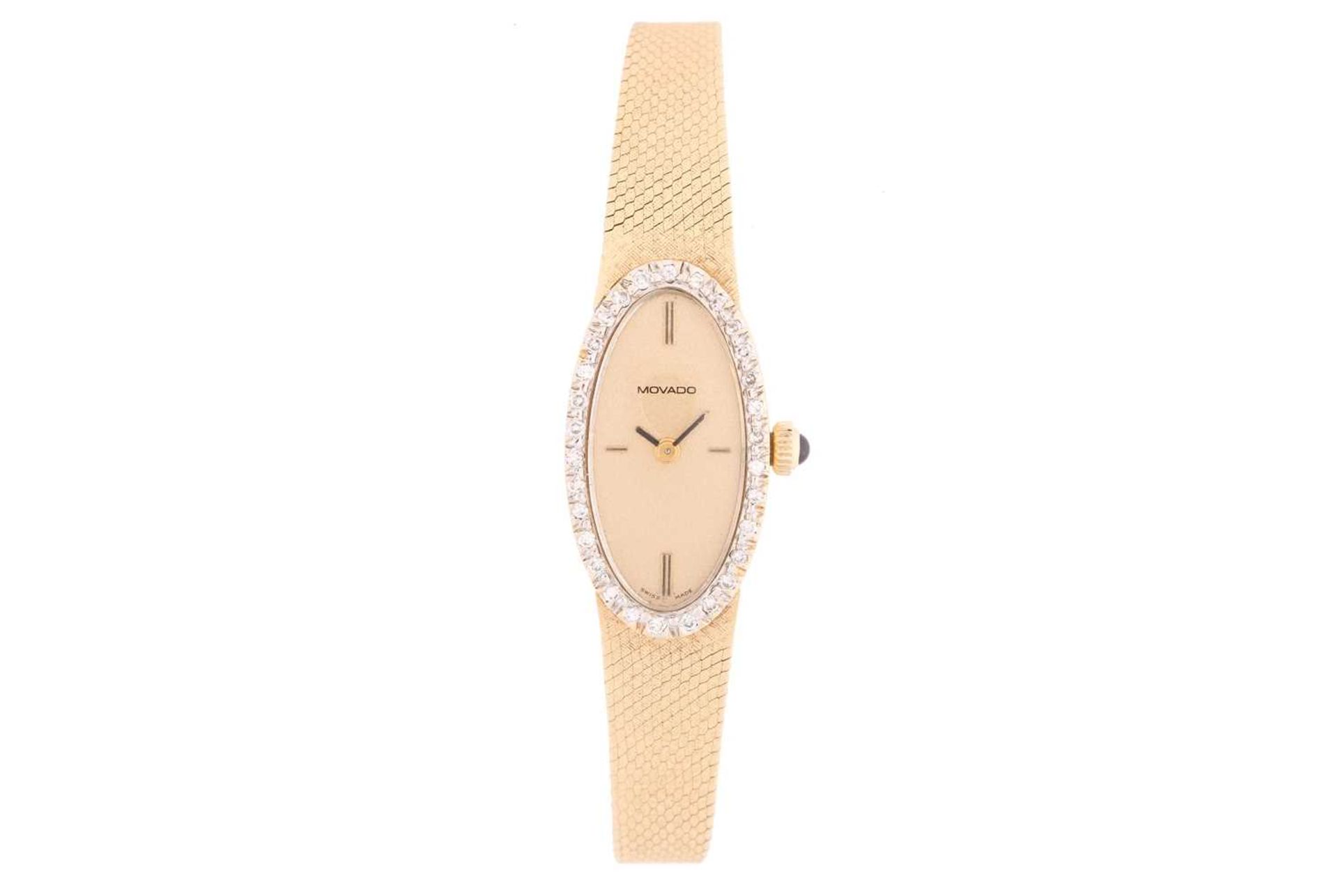 A ladies Movado 14ct yellow gold mechanical wristwatch, the plain gilt dial surrounded by a