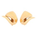 A pair of clip-on earrings of abstract form, the swirl motif fitted with omega clips to the reverse,