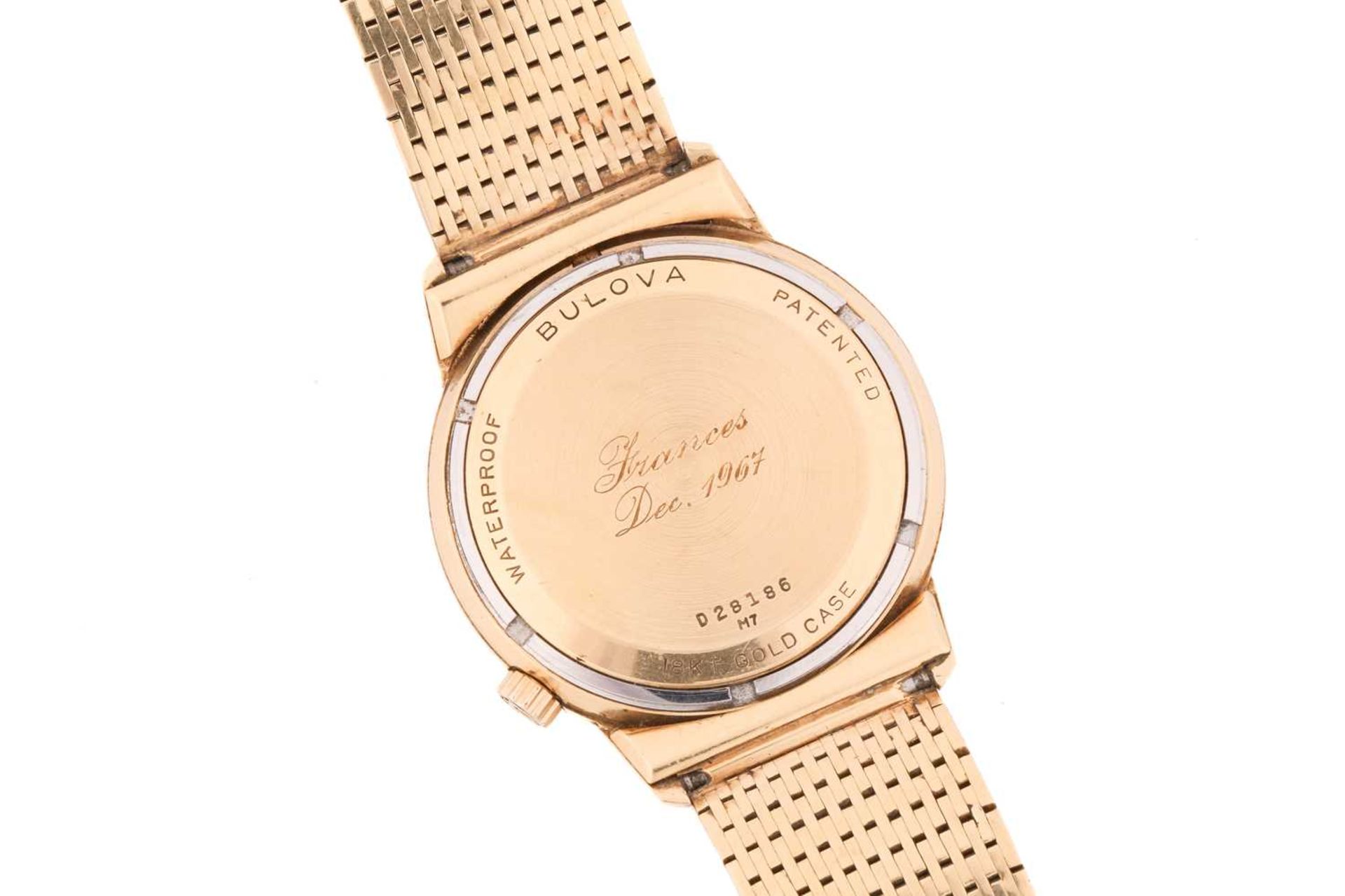 An 18ct gold Bulova Accutron wristwatch, the circular white face with gilt roman numerals and a date - Bild 3 aus 8