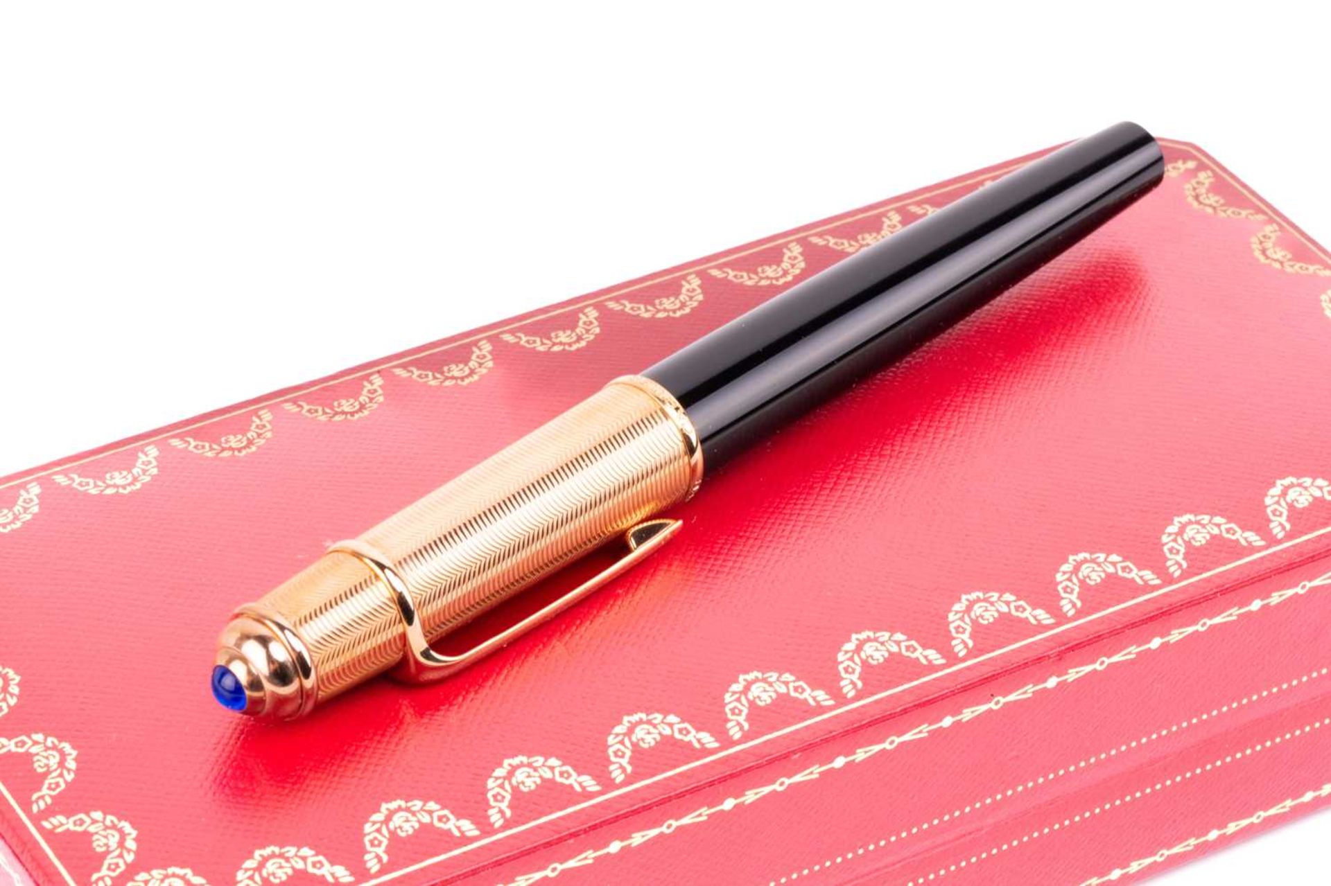 Cartier - A black composite rollerball pen with rose gold plated screw cap with blue glass - Image 8 of 8