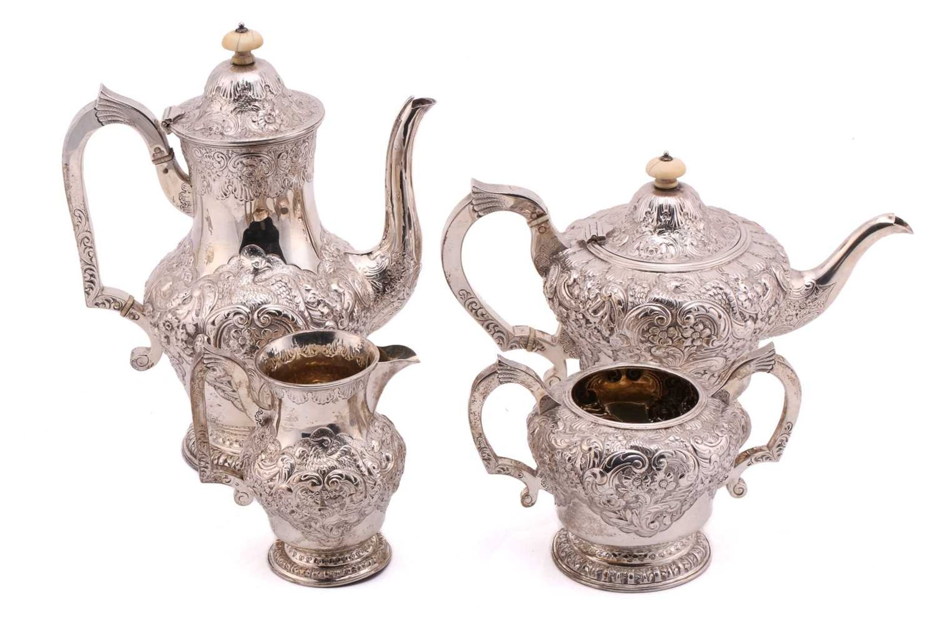 A good quality silver four-piece tea set, Birmingham 1886, comprising a teapot and coffee pot both