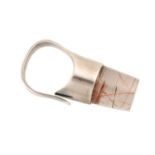 Georg Jensen - a dress ring set with a rutilated quartz, of bottle cork shape, composed of