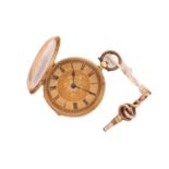 An gold open-faced lady's key wind fob watch with a jewelled bridge movement and matted and tooled