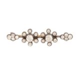 A Victorian diamond-set bar brooch, featuring twenty-two old-cut diamonds in pinched collets,