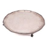 A Mappin & Webb silver salver, Sheffield 1964, of circular form with scalloped and gadrooned rim, on