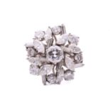 A diamond spray ring, in the centre of the cluster sits a 5.9 mm brilliant-cut diamond, within a
